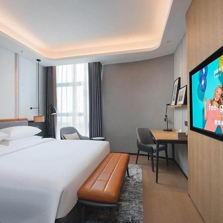 Park Inn By Radisson Nanchong Yilong Star City Plaza Bagian luar foto